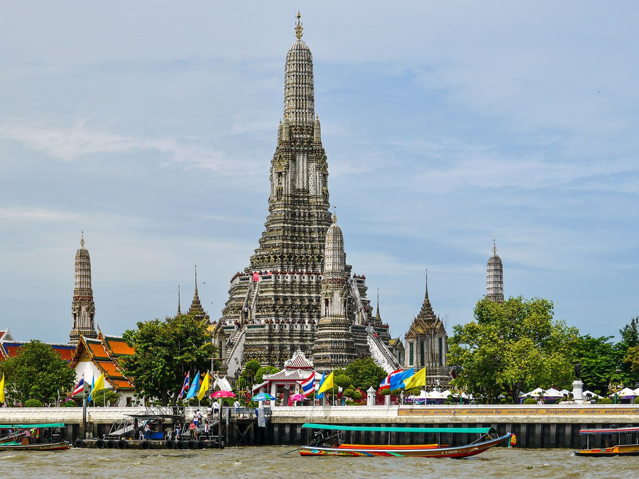 Wat Arun beside the Chao Phraya River in Bangkok, Thailand